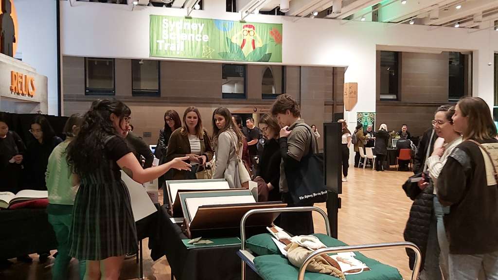 People crowding around a stall at an event
