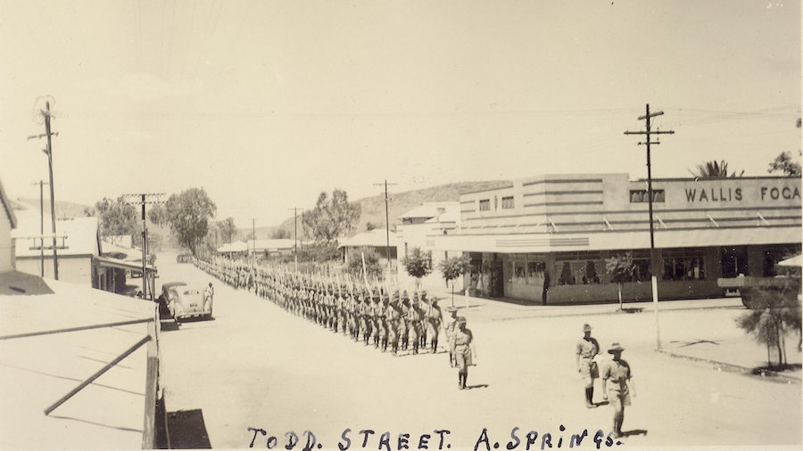 Historic photograph of army marching in Alice Springs between 1938 and 1948