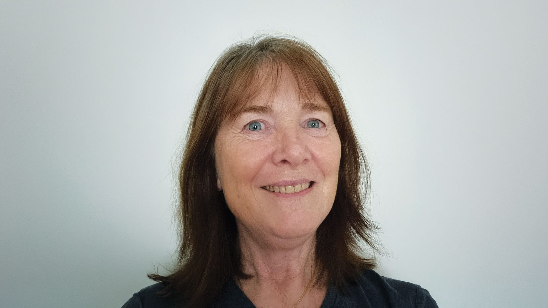 Jane Shelling smiling in a headshot portrait against a plain light background